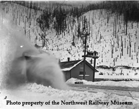 Rotary plow clears snow in front of the Wellington Depot